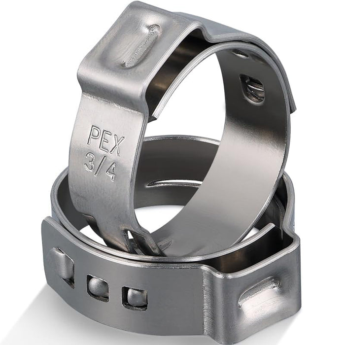 Two 3/4 inch pex crimp rings stacked; 304 stainless band and ear secure barb couplings on residential water lines.