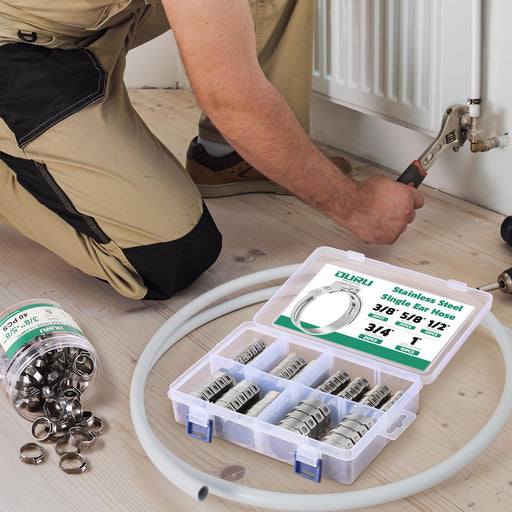 Installer working beside kit of assorted pex pipe crimp rings; bulk jar and case ready for radiator and plumbing repairs.